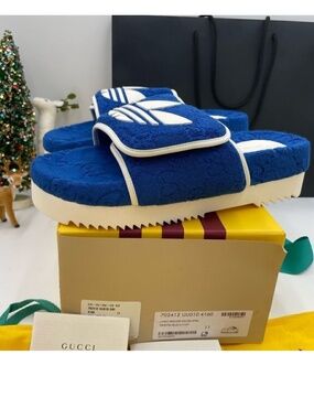Men’s Gucci X Adidas slide sandals. Size 11.. made in Italy.